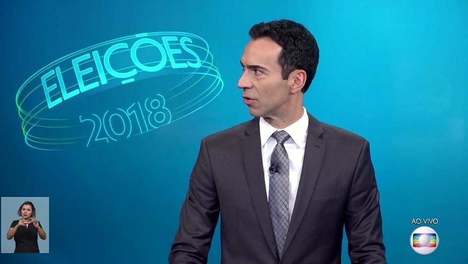 Cesar Tralli durante debate da Globo